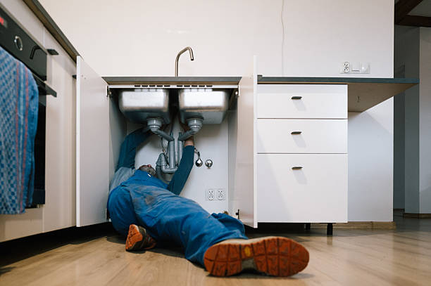 Professional Emergency Plumber technician working in Arlington, WI